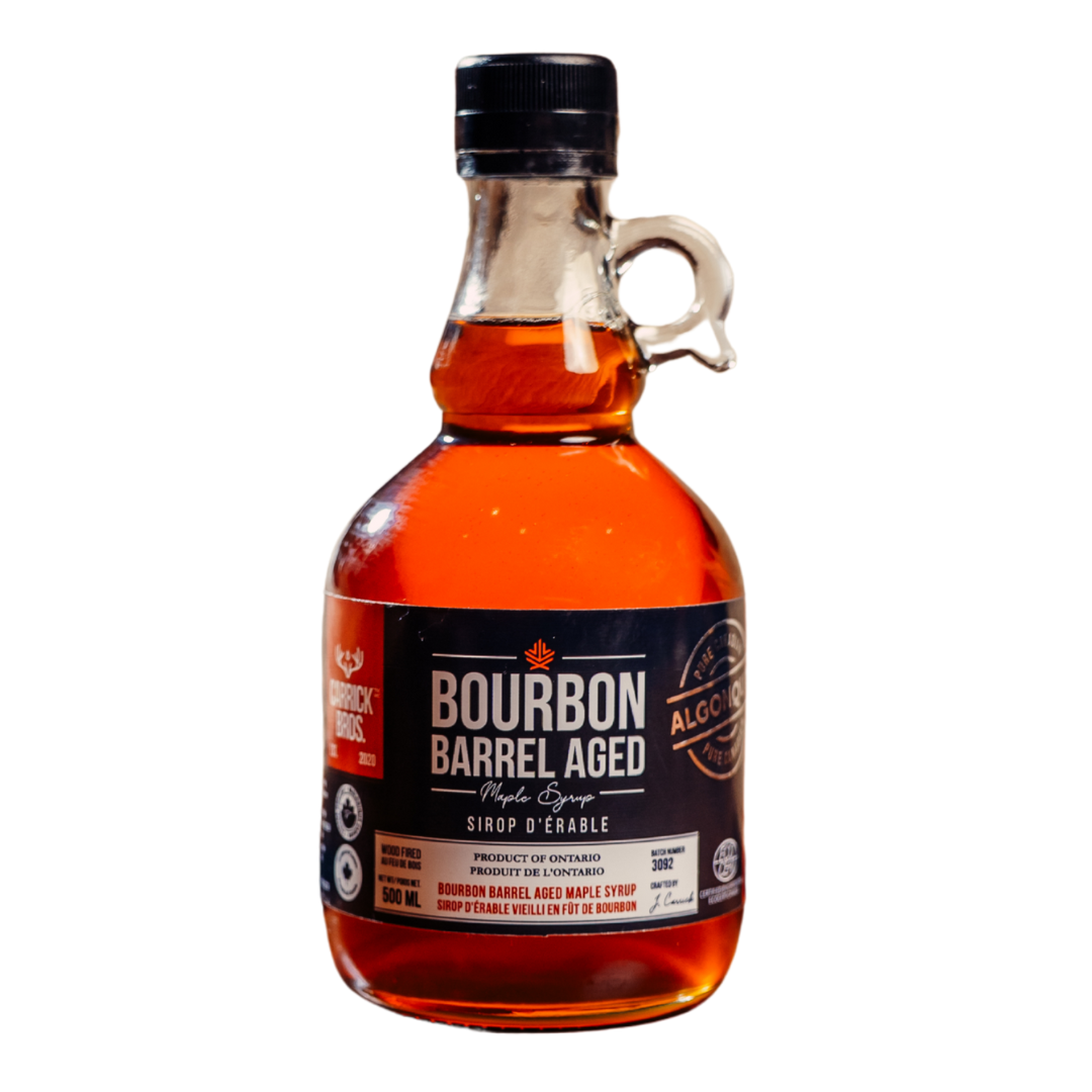 Bottle of Bourbon Barrel Aged syrup on a white background