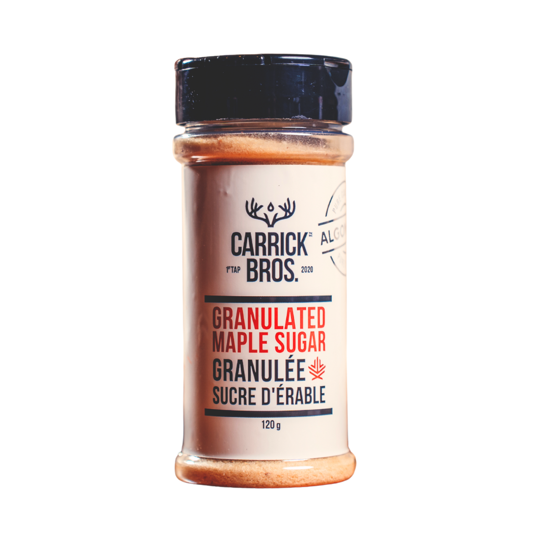 granulated maple sugar on a white background