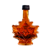 Maple syrup bottle shaped like a leaf with 'Carrick' branding on a white background