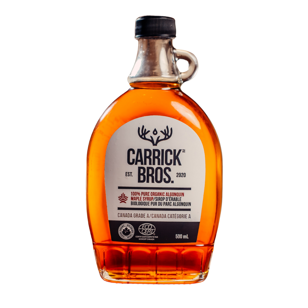 Bottle of Carrick Bros. maple syrup on a white background